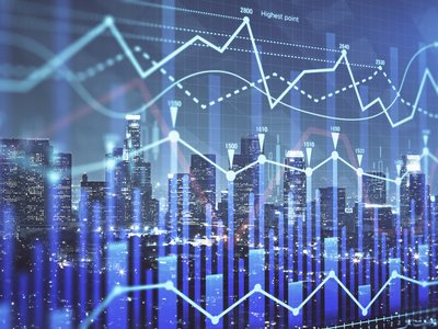 Forex chart on cityscape with tall buildings background multi exposure.
