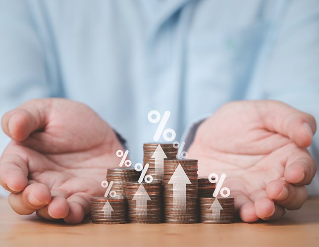 Two hand giving heap of coins money with up arrow and percentage symbol for financial banking increase interest rate