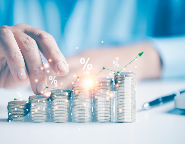 Two hand giving heap of coins money a sparkle with an arrow up